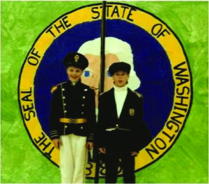 Clay and Nathan by their state seal, a WA state history report on early explorers to the PNW for the state centennial in 1989.