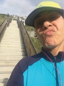 IH resident, Brianna taking a selfie at the stairs 