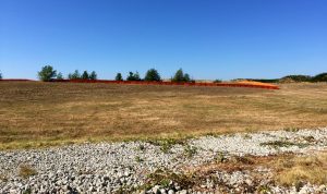 Westridge North Townhomes site fencing as seen from Discovery Drive NE.
